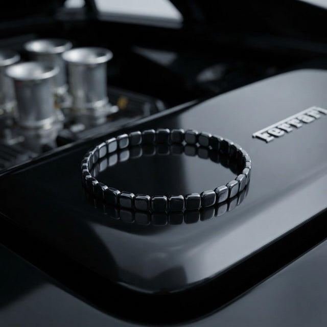 Hematite bracelet on a car engine cover